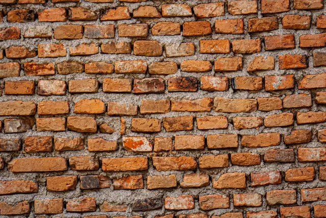 Example photo: weathered brick wall (re-pointing)